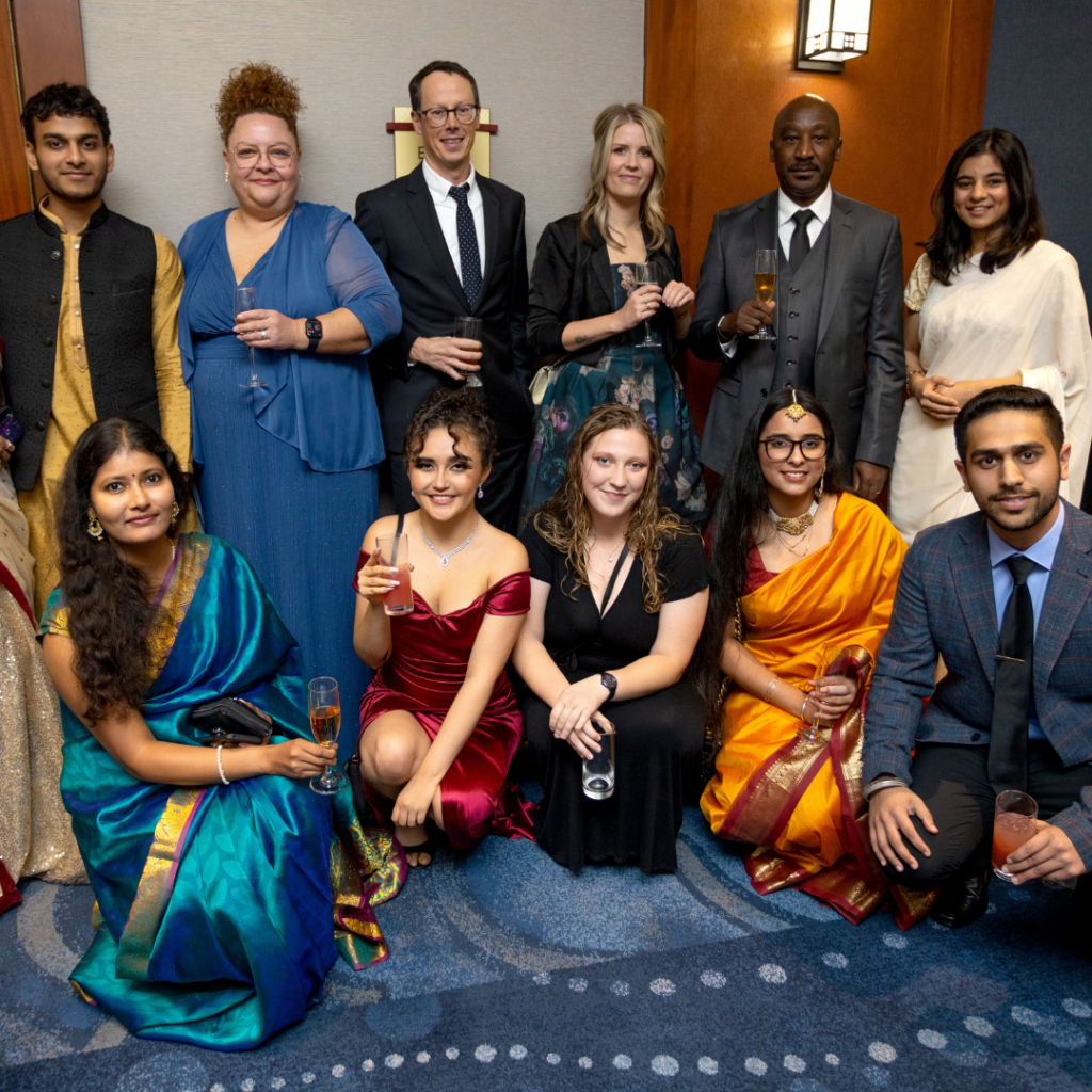 Faculty and students gather for a photo at the Concordia University of Edmonton 2022 World Gala